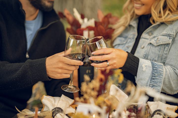 a woman holding a glass of wine
